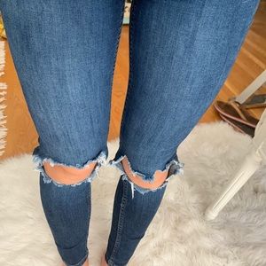 Free People skinny jeans with holes at the knees